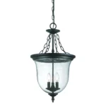 HMS Belle 3-light pendant light hanging above a dining table in a modern living room setting.