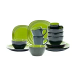Elegant ceramic dinnerware set with green and black salad bowl, dinner plate, and soup bowl on a wooden table