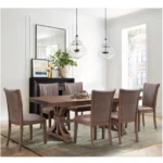 Oak dining table for 6-8, mid-century modern rectangular design with trestle pedestal base in a dining room