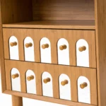 Two drawer nightstand with mirrored front and open shelf in natural wood finish, minimalist design for bedroom storage