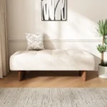 Goldoma modern tufted linen bench with solid wood legs and button tufting in a living room setting