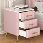 Modern upholstered nightstand with 3 drawers and metal legs in bedroom setting