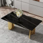Modern dining table with black patterned glass top and gold metal legs in a stylish dining room