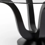 51-inch Clear & Black Glass Pedestal Dining Table with Solid Wood Base – styled in a modern Round Dining Tables setting