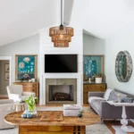 1-Light Farmhouse Rattan Boho Pendant Light as a semi flush mount, installed on a ceiling with warm glow.