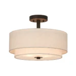 Close-up of the round fabric shade on the Goldoma pendant light, showing the textured material and warm glow.