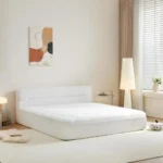 Modern all-in-one bed frame with box spring in cool-touch fabric, featuring motion isolation for undisturbed sleep
