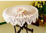 Vintage lace table mats in shabby chic style on a wooden table