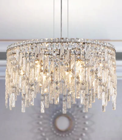 Polished chrome crystal pendant chandelier with 9 lights, 24-inch round canopy, hanging over a modern living room