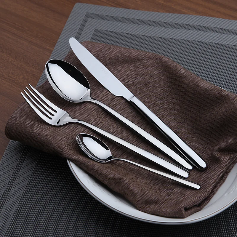 HTB15SbwMXXXXXcnXFXXq6xXFXXXx.webp Goldoma 24-piece stainless steel cutlery set on a wooden table