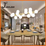 Three white bubble ball pendant lights at different heights over a wooden dining table, creating a modern look.
