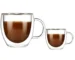 Double wall glass mug with handle holding hot coffee, showing insulation and clear glass design