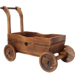 Folding wooden flower cart planter in an indoor living room setting with greenery.