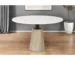 48-inch round pedestal dining table with white marble top and natural wood pedestal base in a modern dining room