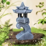 Close-up of zen-inspired stone palace lantern showing textured granite finish and solar panel.