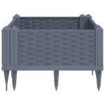 Blue grey polypropylene medium garden planter with flowers on patio