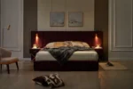 Goldoma velvet storage bed with channel tufted wingback headboard in blue, showing under-bed storage and wooden slats