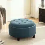 Goldoma 29.33"W Upholstered Round Ottoman with Reversible Lid – Fleece Fabric Storage Stool for Living Room – in a cozy room