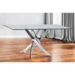 63-inch clear glass dining table with stainless steel pedestal base in a modern dining room setting
