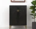Modern rustic bar cabinet with black gold finish and faux rattan accents in a living room setting
