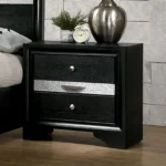 Contemporary black nightstand with hidden drawer and nickel knobs on a bedroom background