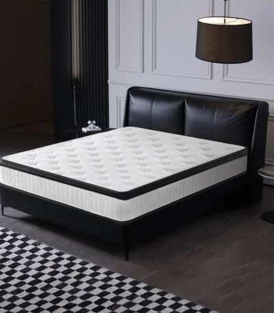 Goldoma 12-inch hybrid queen mattress with memory foam and pocketed coils in medium firmness, displayed on a bed frame