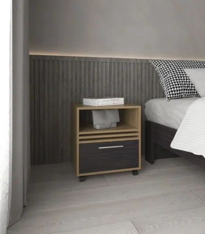 Modern rolling nightstand with one drawer and shelf in natural oak and black finish, placed beside a bed
