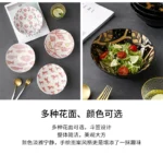 White ceramic ramen bowl with ramen noodles and chopsticks on a wooden table