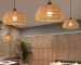 Modern chandelier pendant lighting with adjustable height hanging wires in a contemporary dining room