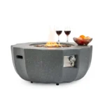 Eco-friendly petal-shaped propane fire bowl with blue flames on patio