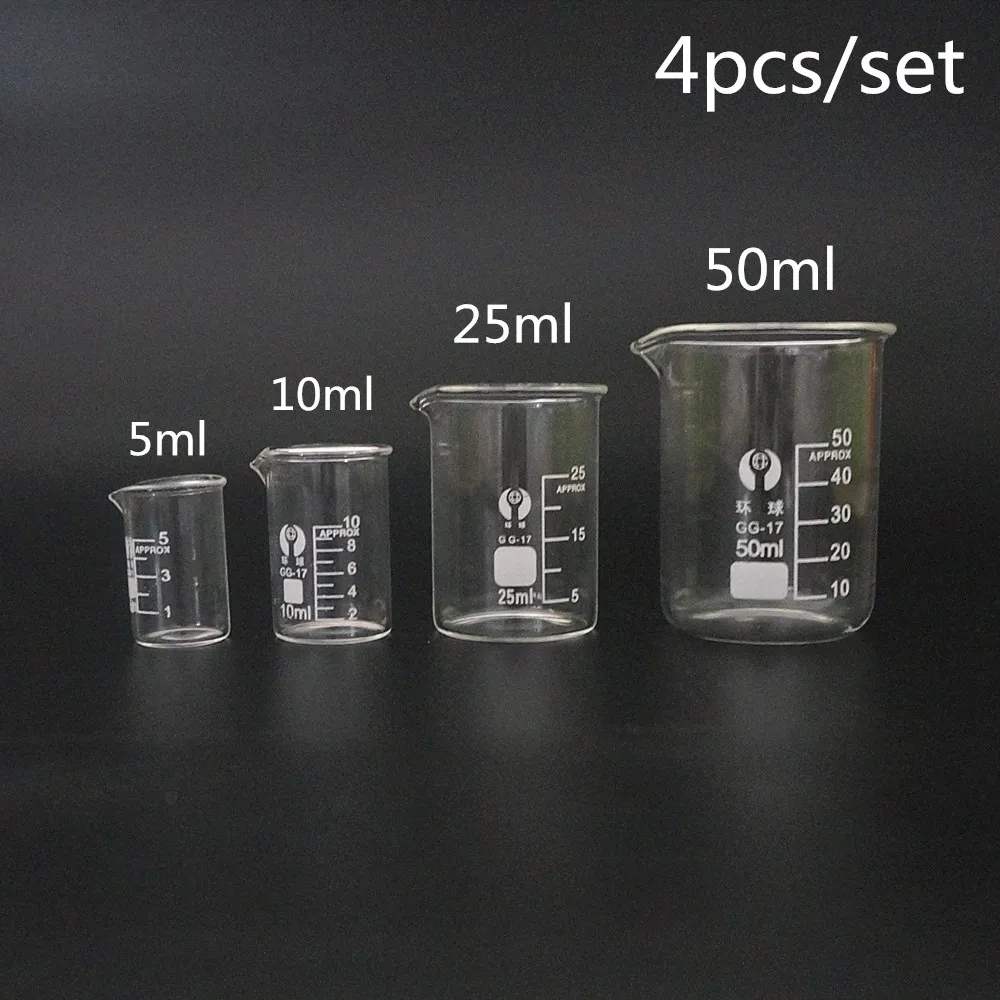 Set of four glass lab measuring cups with 5ml, 10ml, 25ml, and 50ml capacities arranged on a white surface