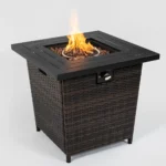Square propane fire pit table with wicker base on patio