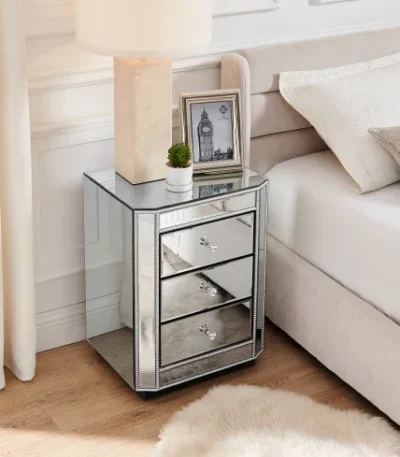 Crushed diamond mirrored nightstand with three drawers in a modern bedroom setting