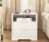 Modern bedside table with USB charging station and storage drawer in a bedroom setting