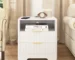 Modern bedside table with USB charging station and storage drawer in a bedroom setting