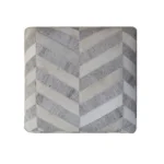 Goldoma gray and ivory hair on hide chevron pouf ottoman in a living room setting