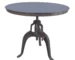 Industrial gray round adjustable height table with crank base in a modern dining room