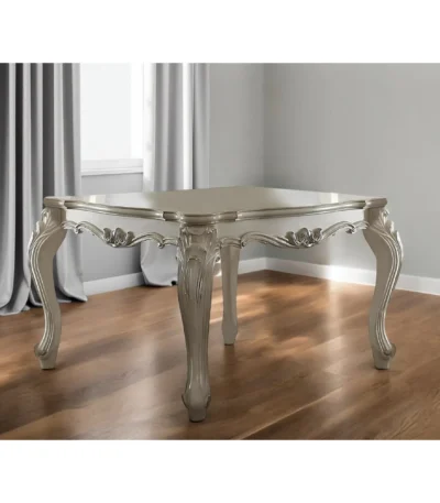 55-inch antiqued white solid wood dining table seating six in a modern dining room