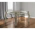 Antiqued white solid wood rectangular dining table seats 6 in a cozy dining room