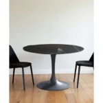 47 inch ceramic pedestal dining table in black with round ceramic top and metal base from Goldoma