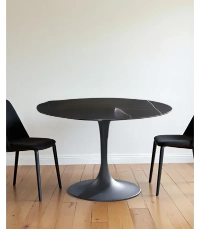 47 inch ceramic pedestal dining table in black with round ceramic top and metal base from Goldoma