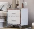 Modern mirrored nightstand 2 drawers with high-gloss finish and chrome handles beside a bed