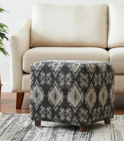 Goldoma gray cube ottoman with wood base and brown faux leather sides, used as a footrest