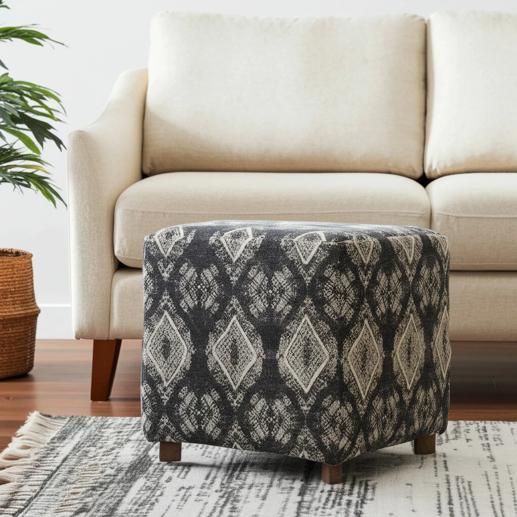 Haf7dfc6d3b7344abbf17db6c96ea29fdP.webp Goldoma gray cube ottoman with wood base and brown faux leather sides, used as a footrest