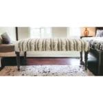 Goldoma 47-inch cream boho stripe upholstered bench with black metal legs in a living room setting