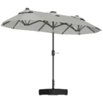 Gray cantilever offset patio umbrella providing shade over outdoor dining set