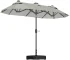 Gray cantilever offset patio umbrella providing shade over outdoor dining set