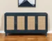 Blue mid century modern sideboard with distressed mango wood and rattan doors in a living room