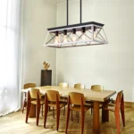 Goldoma 32-inch black and white 5-light pendant chandelier with modern metal cage design, hanging from ceiling in a