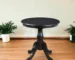 30 inch round dining table with black pedestal base in a modern dining room